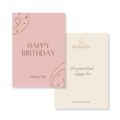 a pink happy birthday greetings card with a personalised message added on the reverse side.