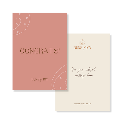 a pink colour "Congrats!" greeting card with a personalised message on the reverse