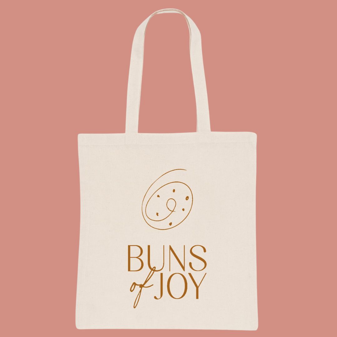 Image of a natural colour cotton tote bag branded with the buns of joy logo