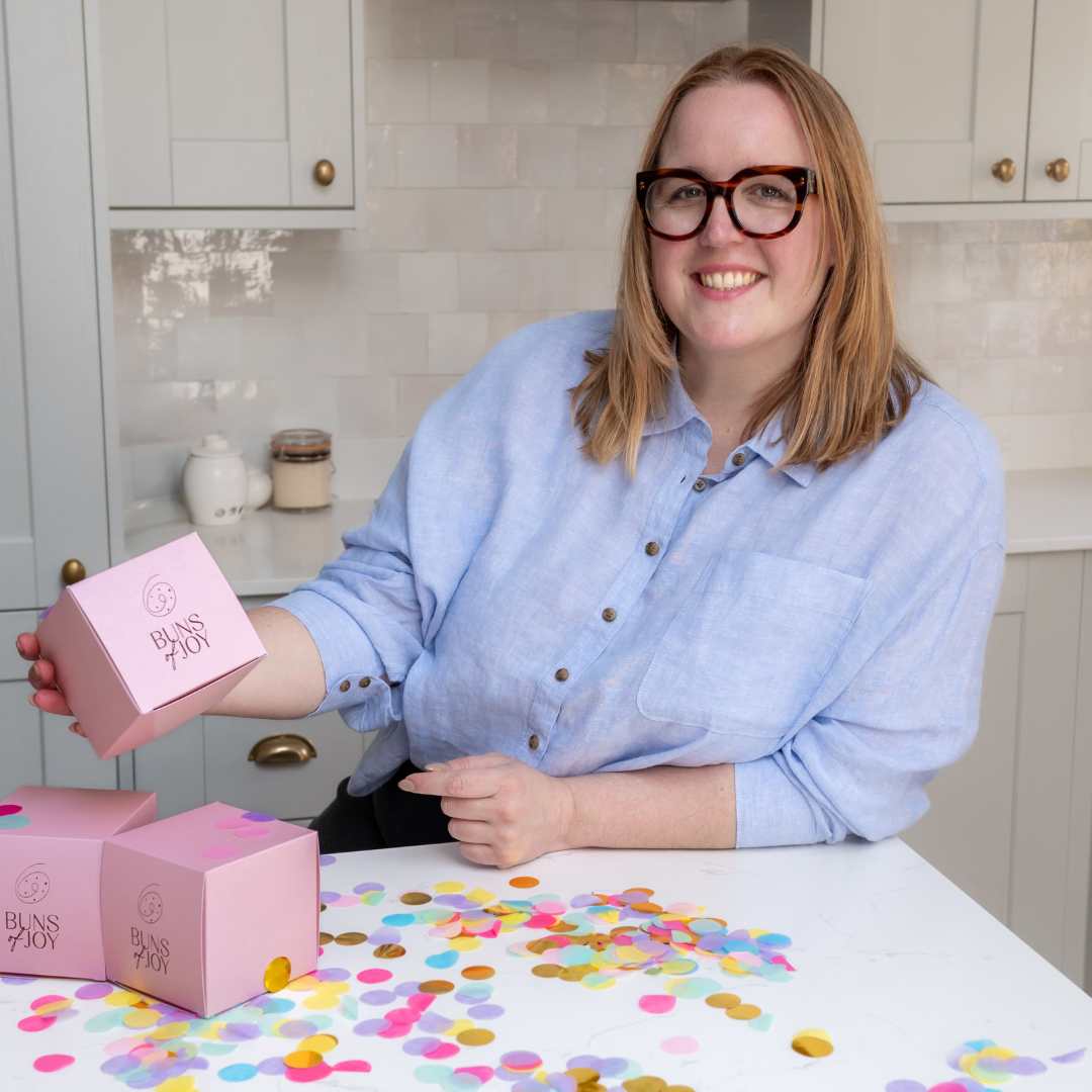 image of Leah holding an individual bun box